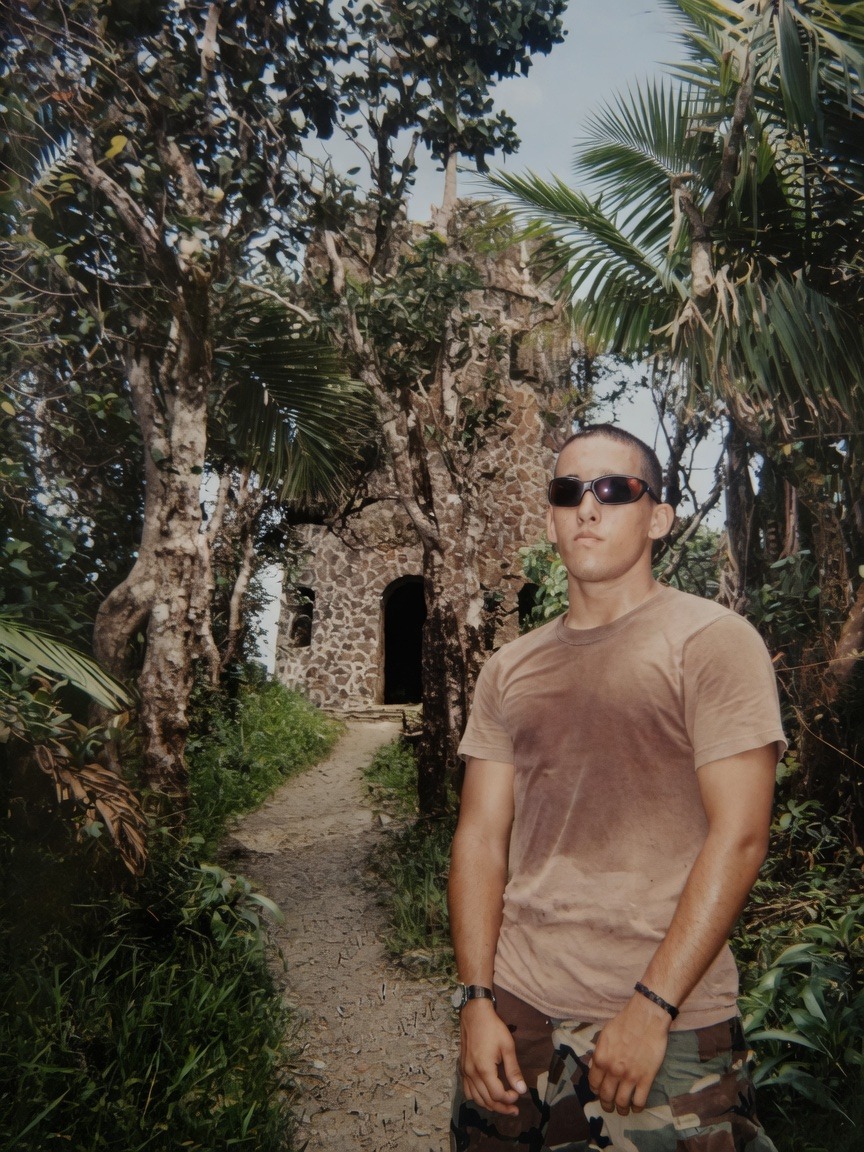 Commander in jungle environment, sunglasses, Army fatigues &mdash; field training still