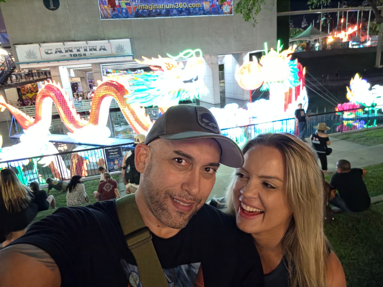 Commander and Night Shade selfie with neon dragon lanterns and Cantina 1854